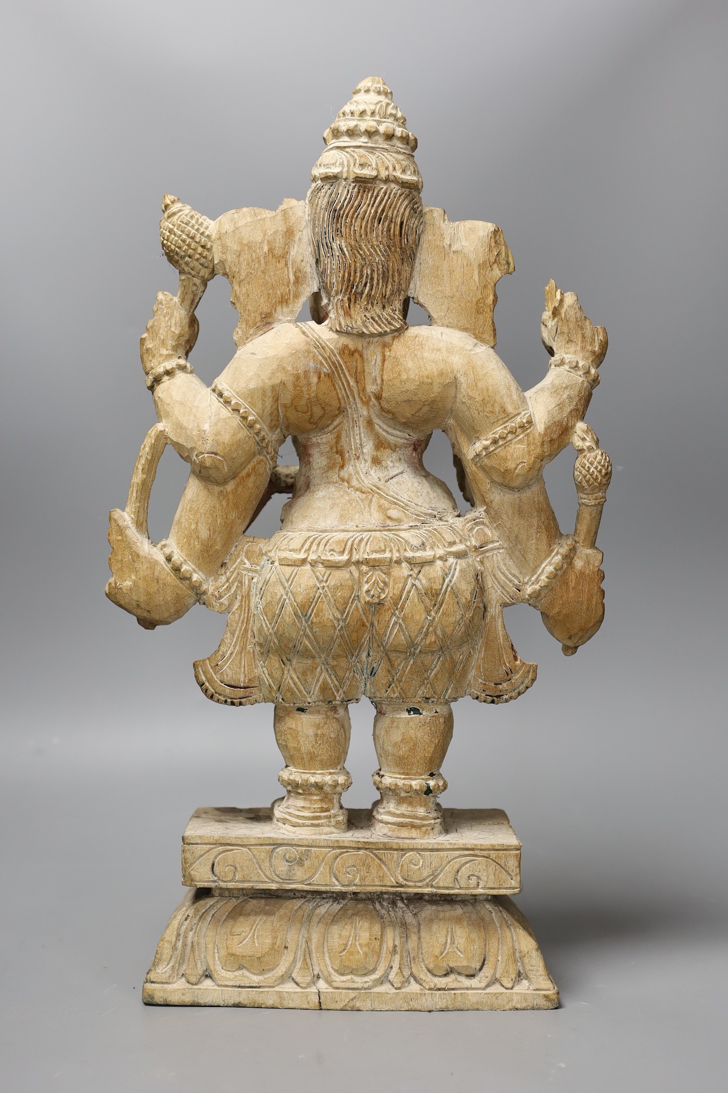 An Indian carved wood figure of Ganesha, 46cm tall